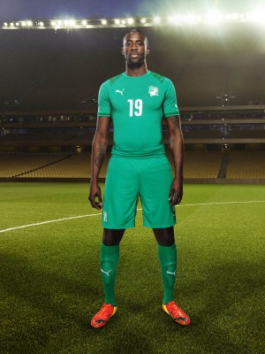 Yaya Touré in the 2014 Ivory Coast Away Kit that features PUMA's PWR ACTV Technology